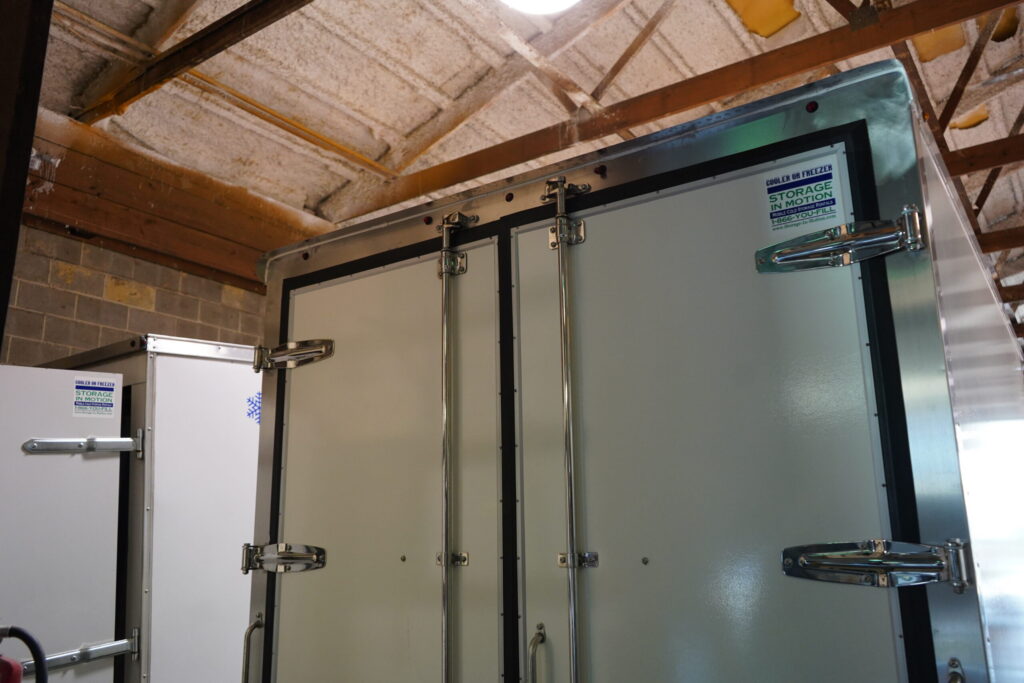 Rear of 2026 NEW Govi 7' x 16' Seamless trailer with doors closed.
